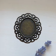 Fém medál alap 19*25mm ovál, széles csipkés, bronz színű