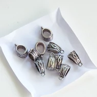 Fém medál nikkel színű dombor mintás ovál 8*13mm