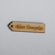 Fa tábla szalagfelirat 17*64mm egy lyukkal: "Áldott Ünnepeket!"